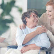 A woman and an older person smiling for the camera.