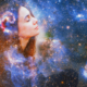 Woman's face blending with cosmic background.